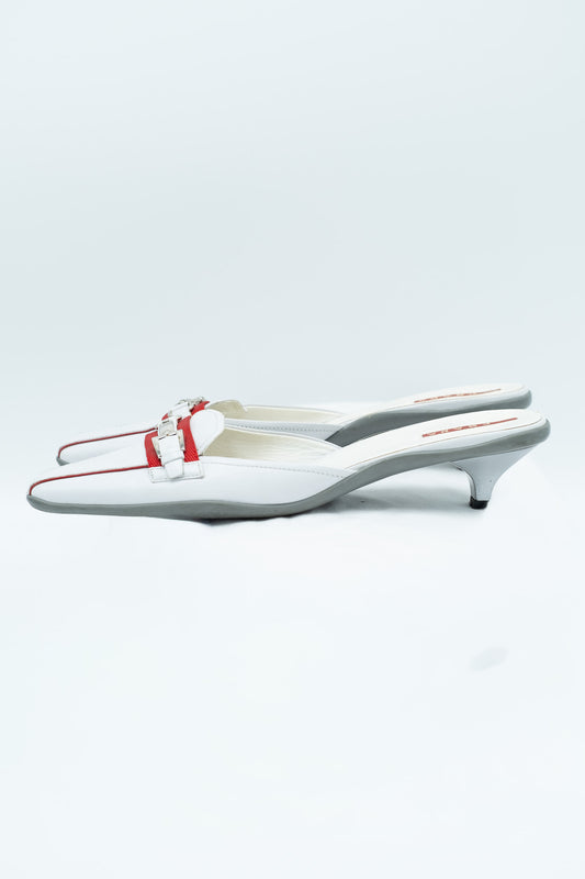 Prada white leather mules with red detail