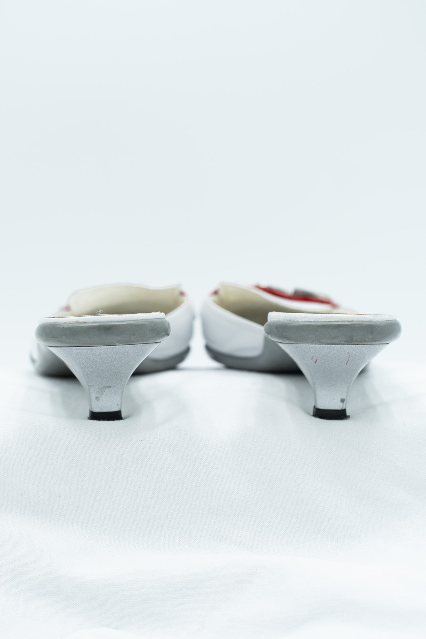 Prada white leather mules with red detail