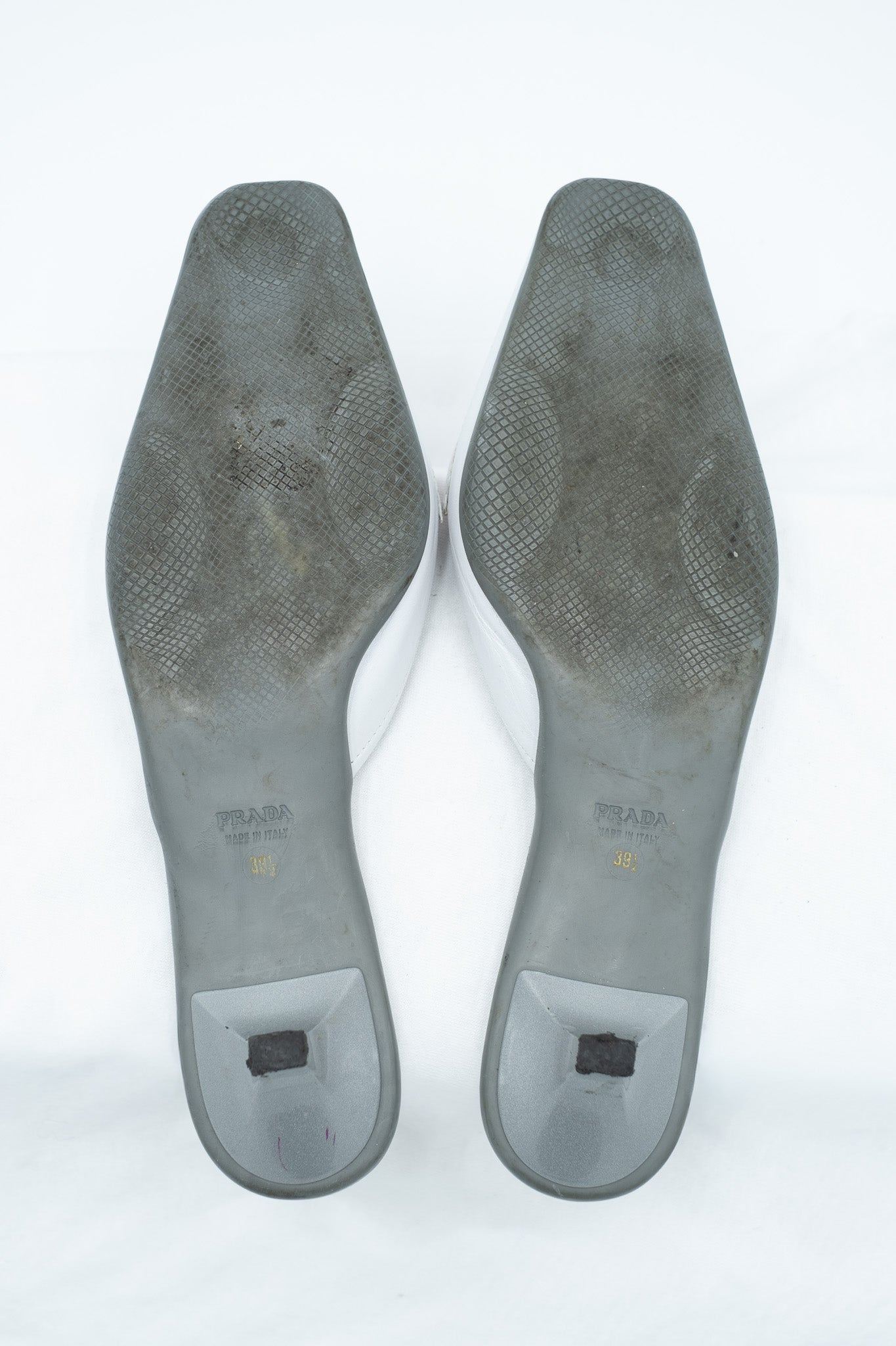 Prada white leather mules with red detail
