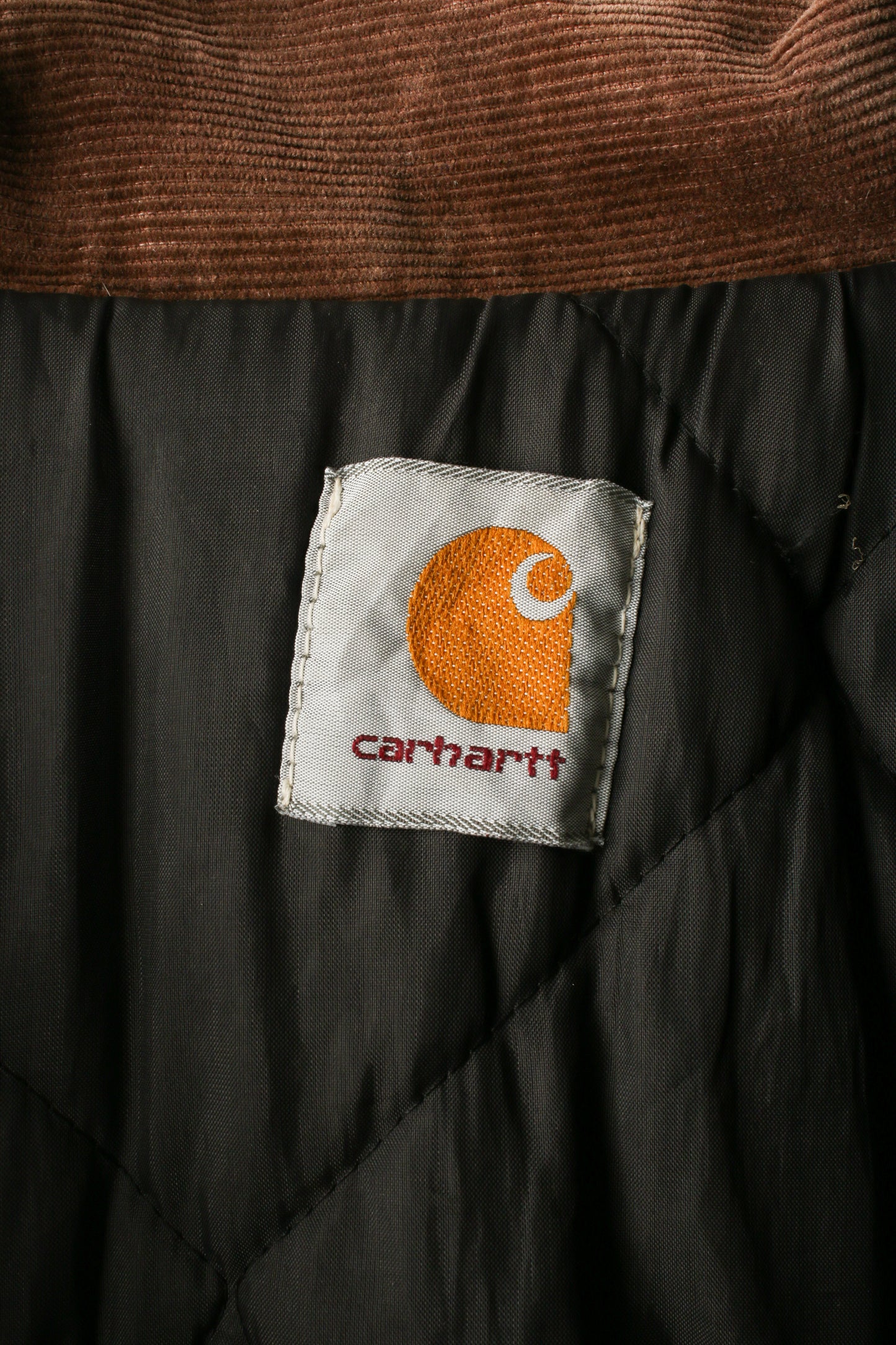 Carhartt quilted jacket with corduroy collar